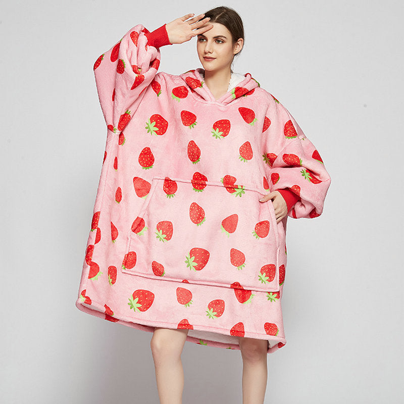 Person in an oversized printed hoodie blanket