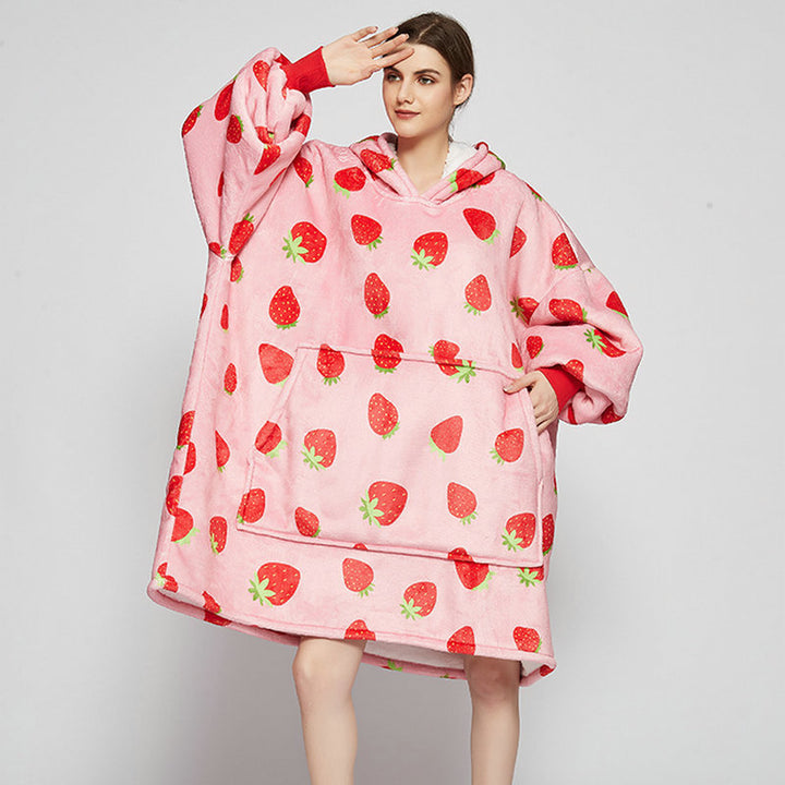 Person in an oversized printed hoodie blanket