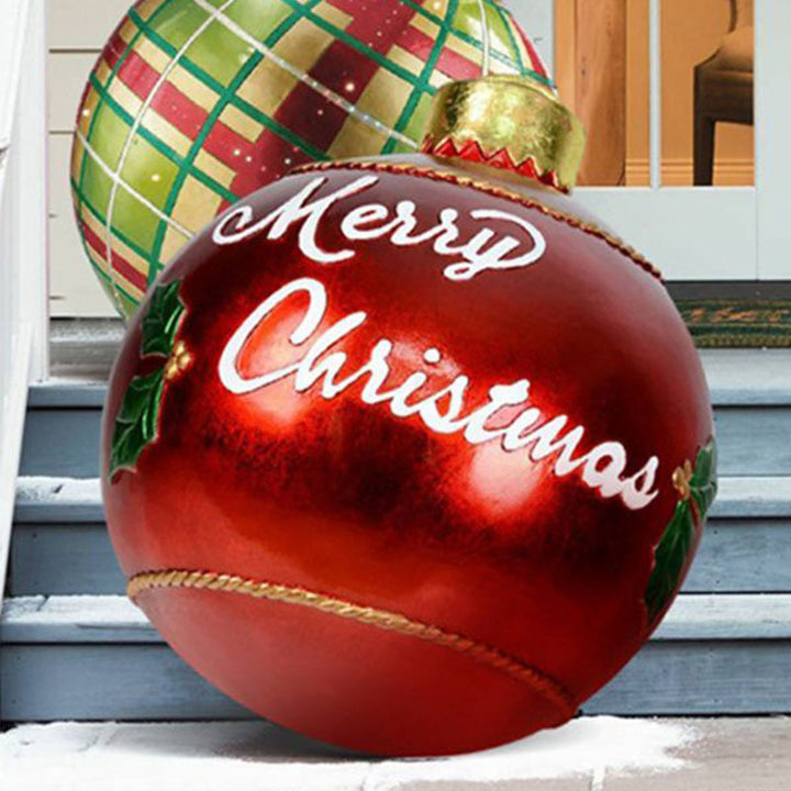 Giant inflatable Christmas bauble in garden