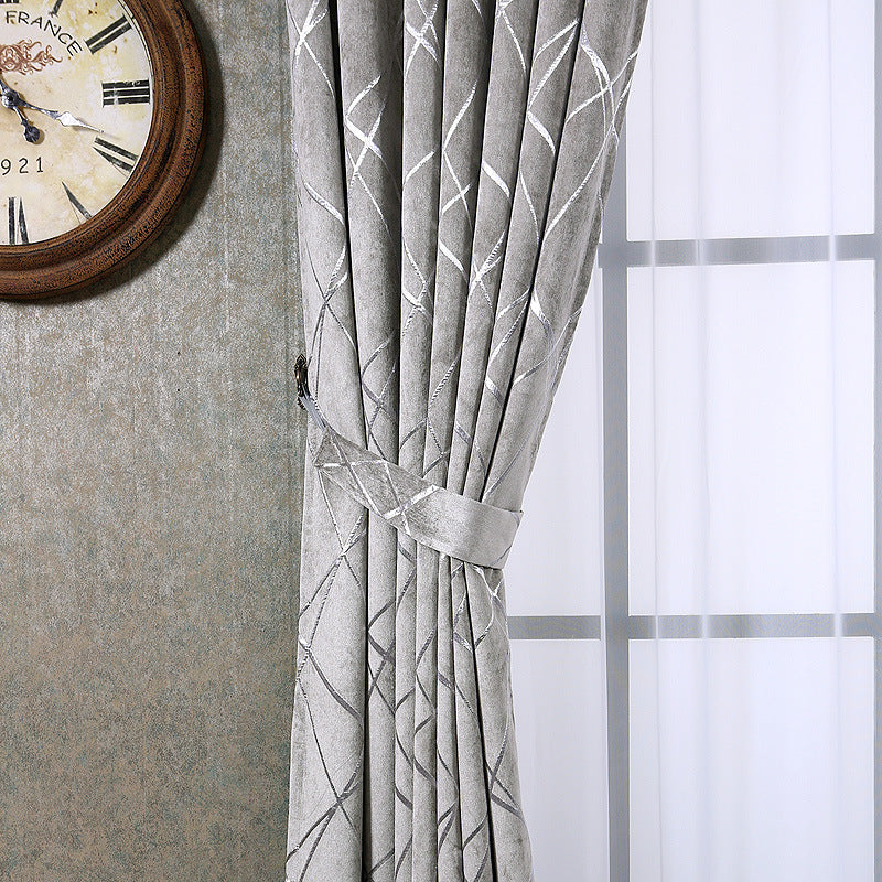 Grey chenille blackout curtain at window