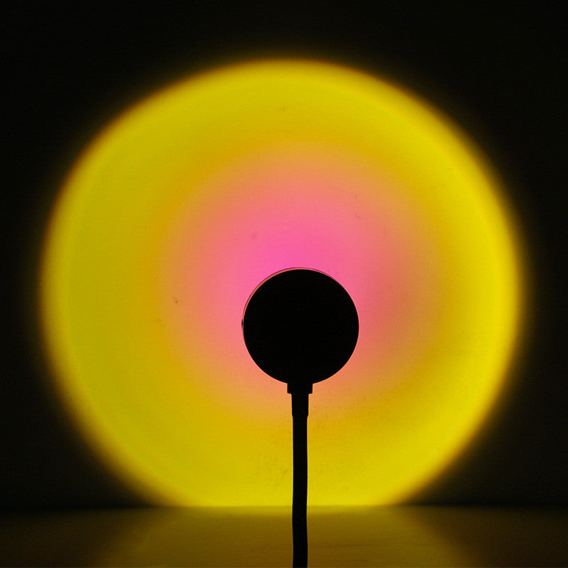 Sunset lamp projecting warm light on a wall