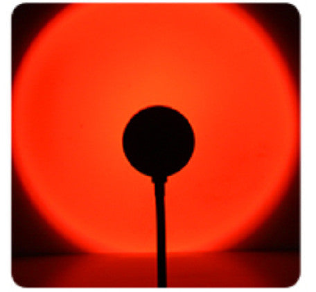 Sunset lamp projecting warm light on a wall