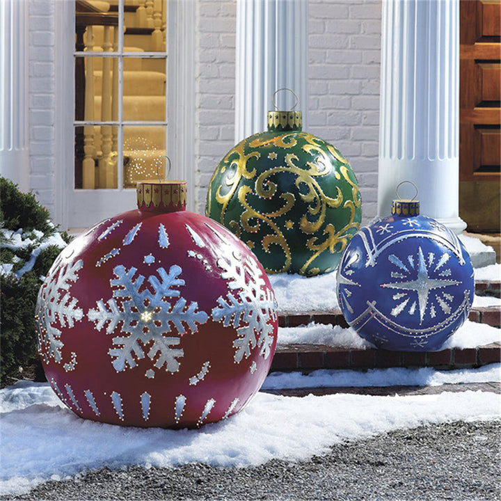 Giant inflatable Christmas bauble in garden