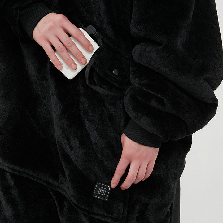 Person in a heated hoodie blanket