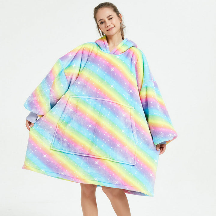Person in an oversized printed hoodie blanket