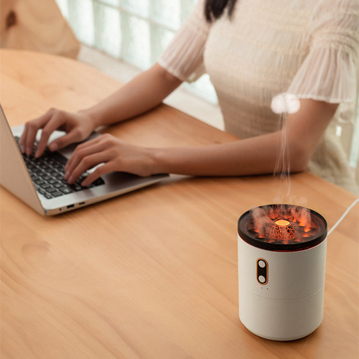 Volcano diffuser puffing glowing mist rings