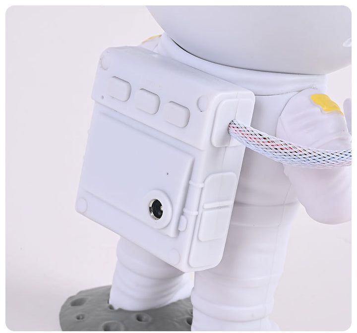 Astronaut star projector on a shelf