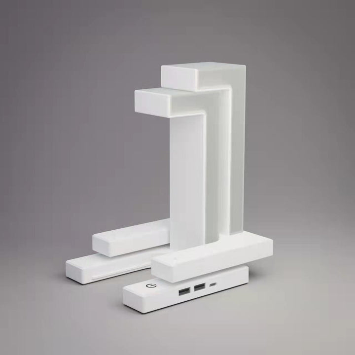 Floating balance lamp with phone on charging base