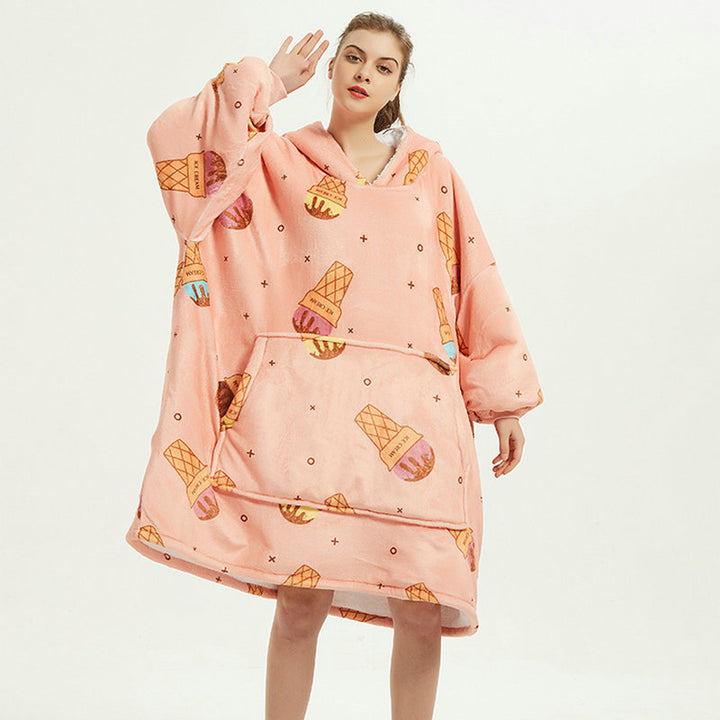 Person in an oversized printed hoodie blanket
