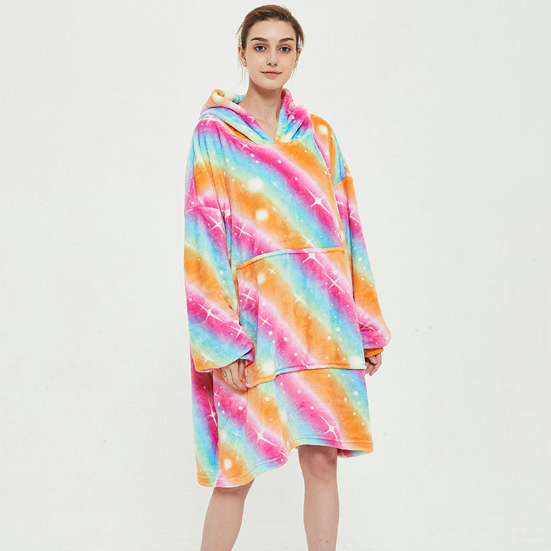 Person in an oversized printed hoodie blanket