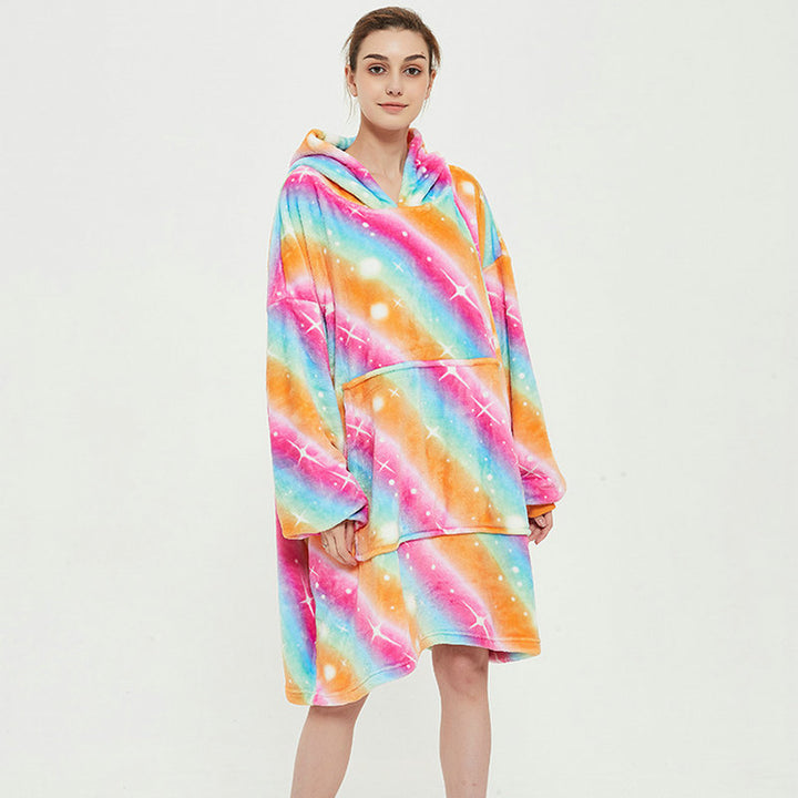 Person in an oversized printed hoodie blanket