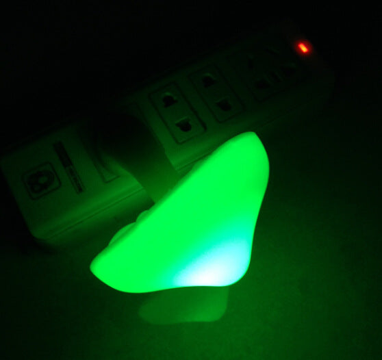 Glowing mushroom night light in wall