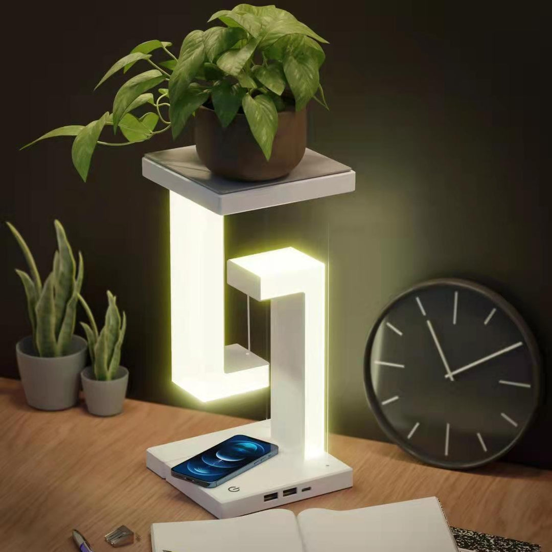 Floating balance lamp with phone on charging base