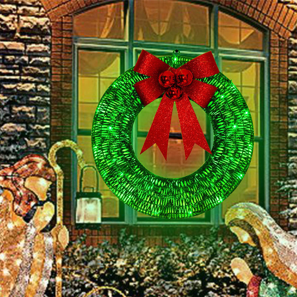Gold tinsel wreath with lights and red bow