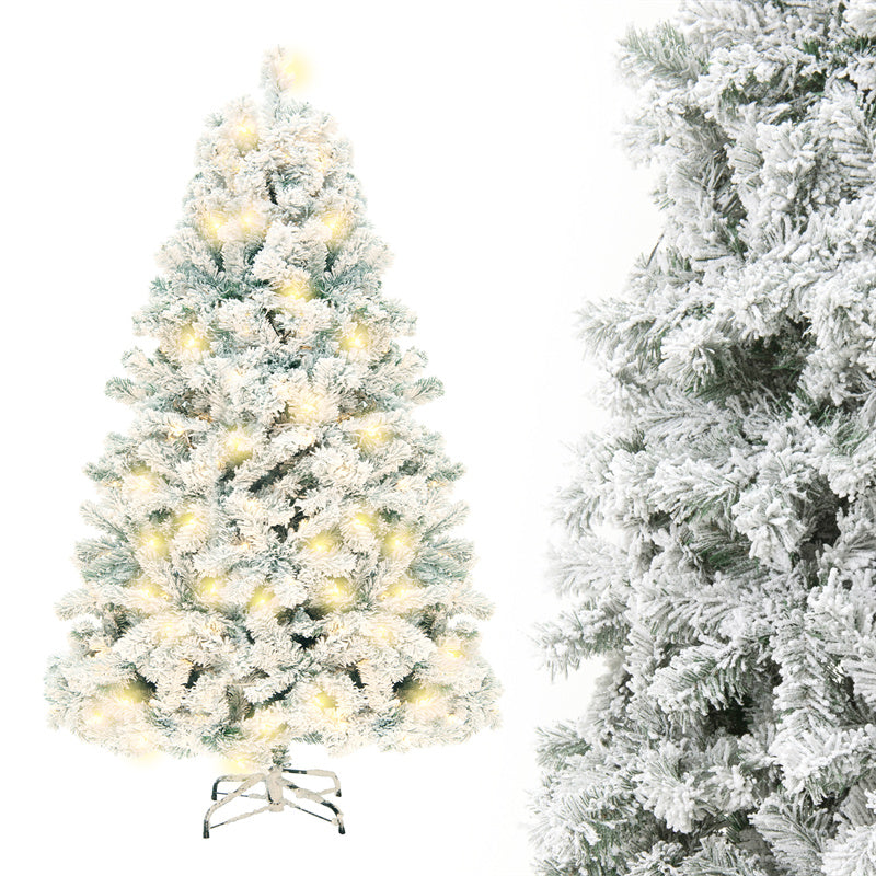 Snow-flocked Christmas tree with warm-white lights