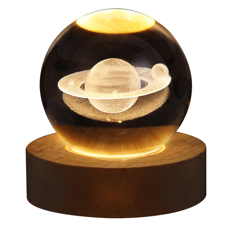Glowing crystal ball lamp on wood base