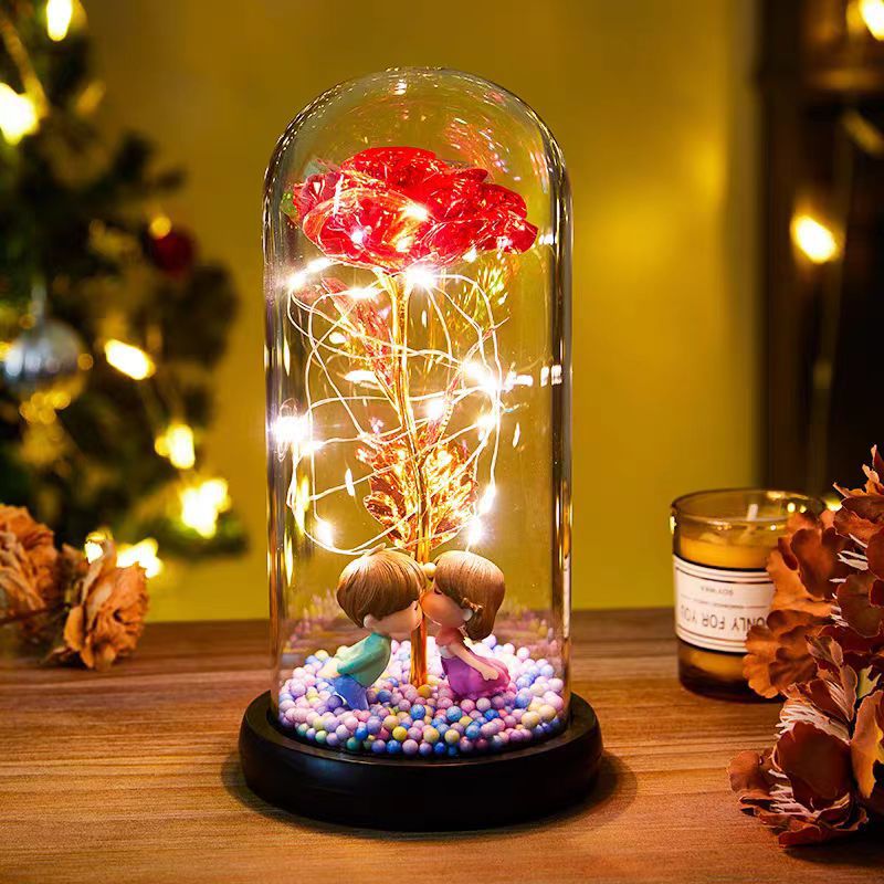 Red rose in glass dome with lights