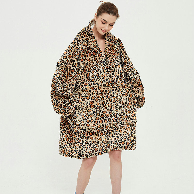 Person in an oversized printed hoodie blanket