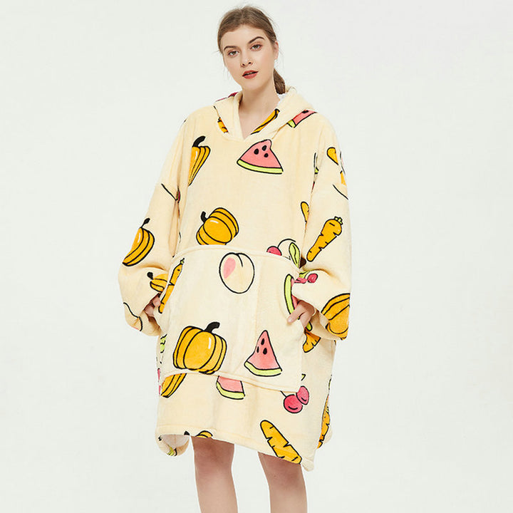 Person in an oversized printed hoodie blanket