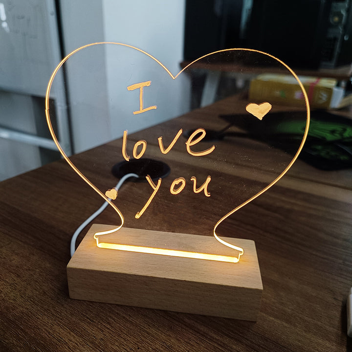 Glowing acrylic message board on wooden base