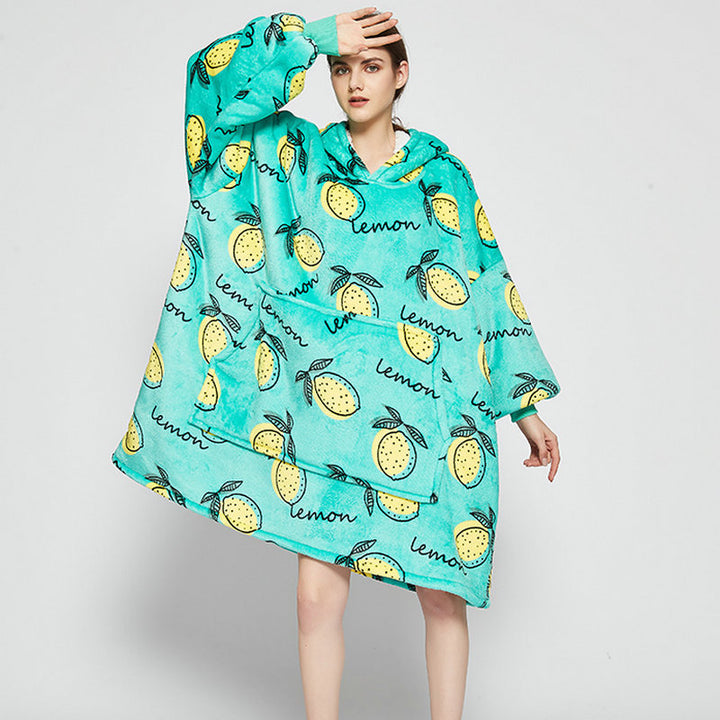 Person in an oversized printed hoodie blanket