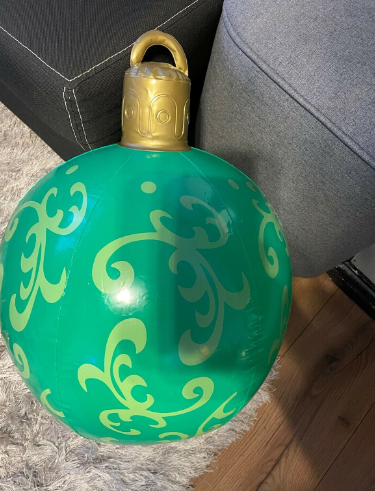 Giant inflatable Christmas bauble in garden