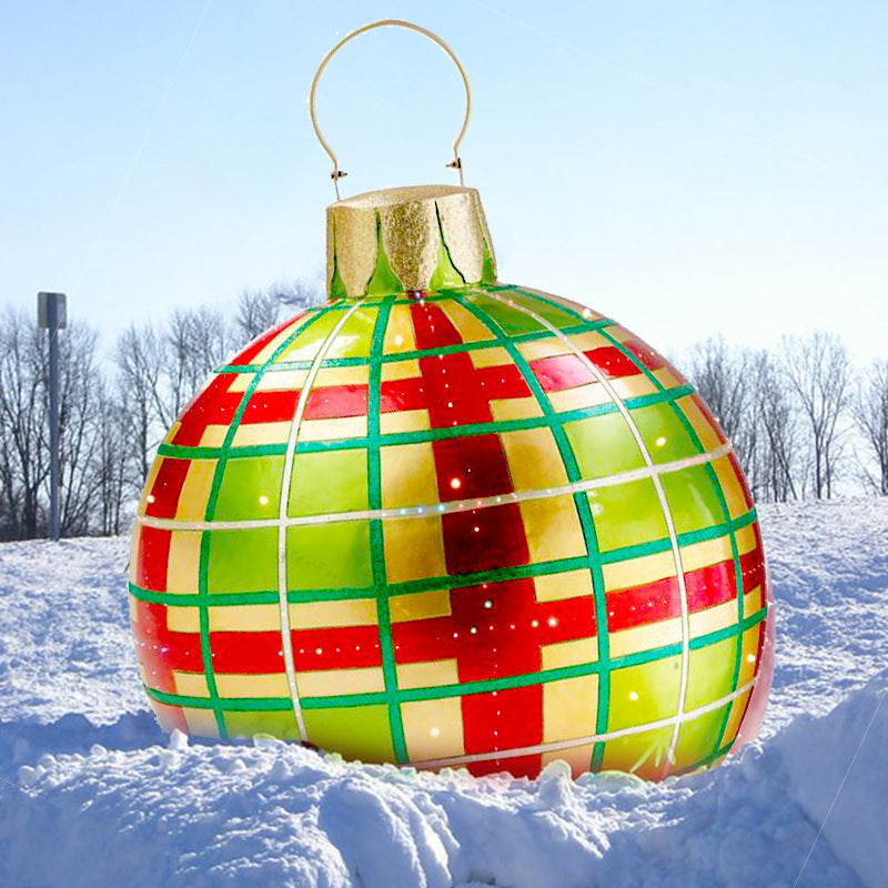 Giant inflatable Christmas bauble in garden