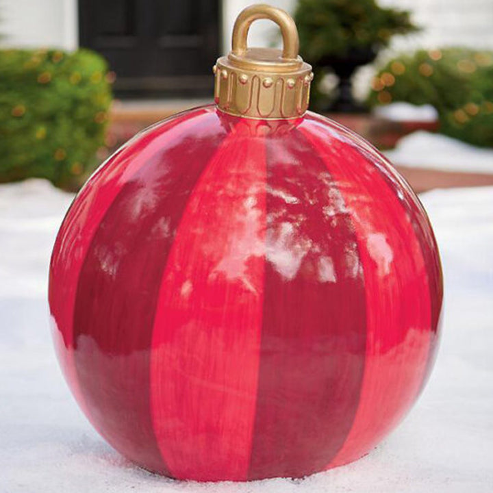 Giant inflatable Christmas bauble in garden
