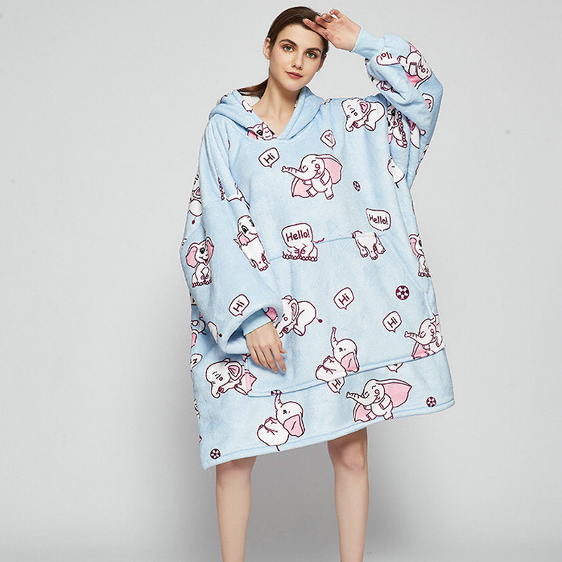 Person in an oversized printed hoodie blanket
